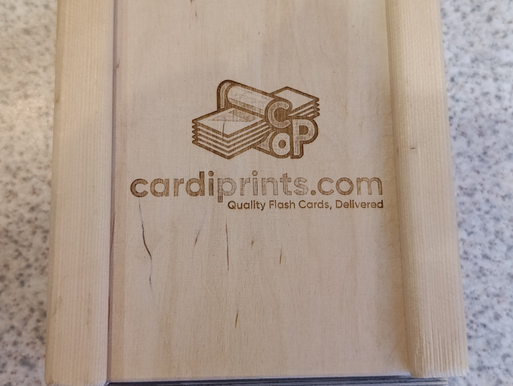 Wooden box with 'cardiprints.com' branding on a textured surface